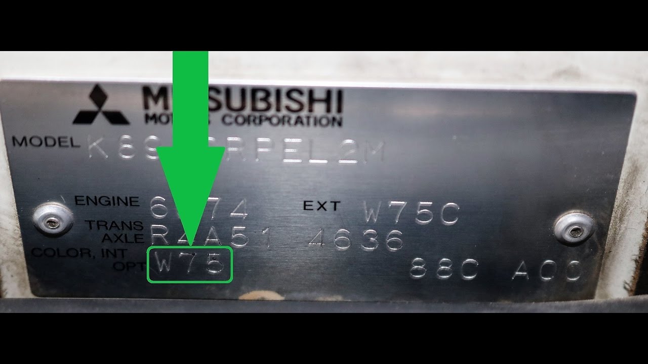Mitsubishi paint code label on the vehicle – find your exact color match.